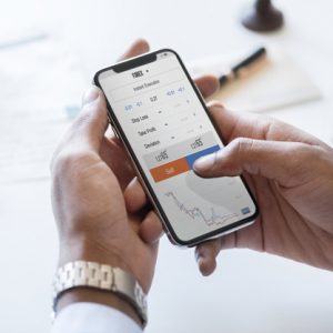 Businessman checking stock market online